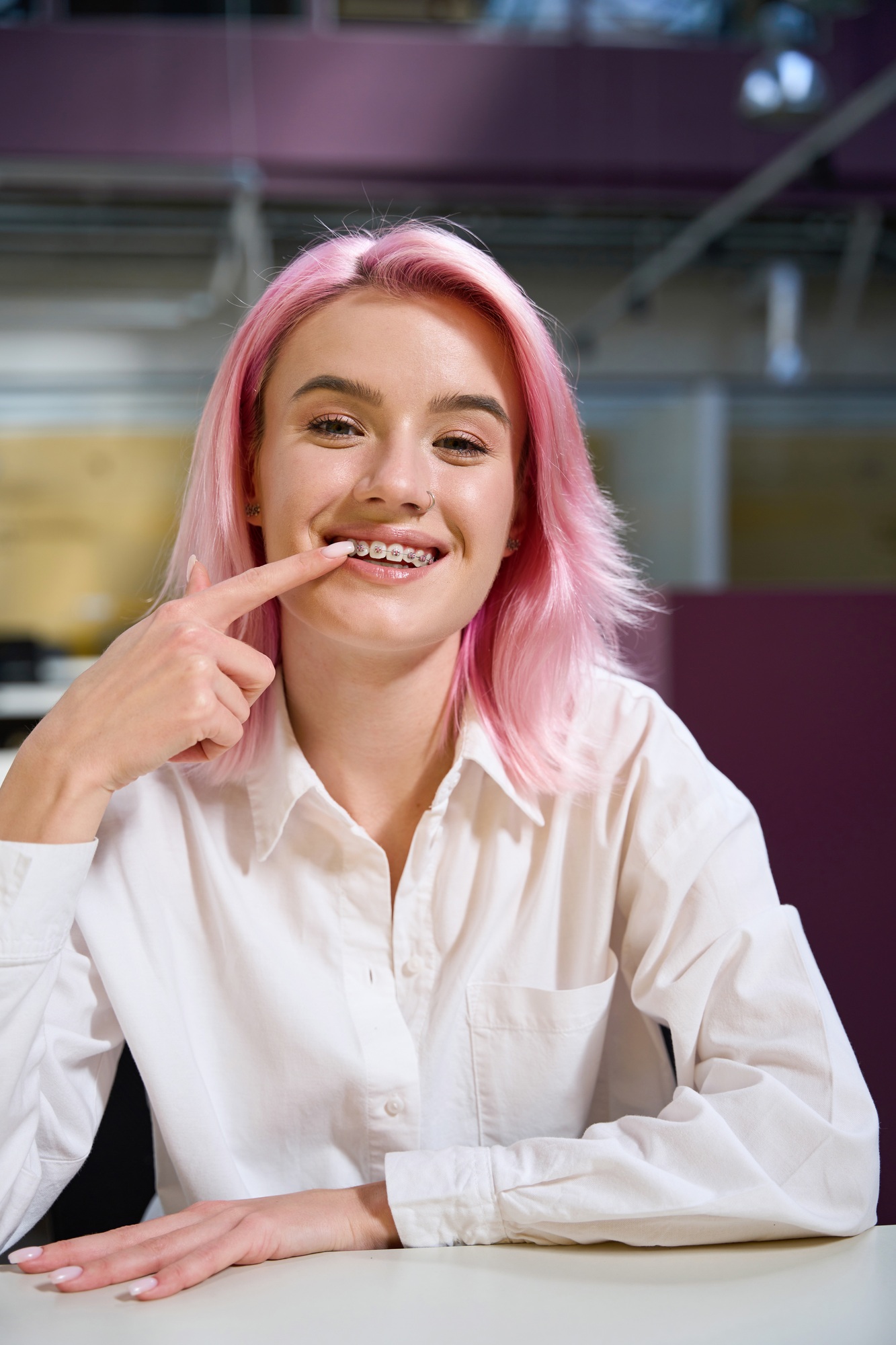 Happy lady showing off her newly fitted braces