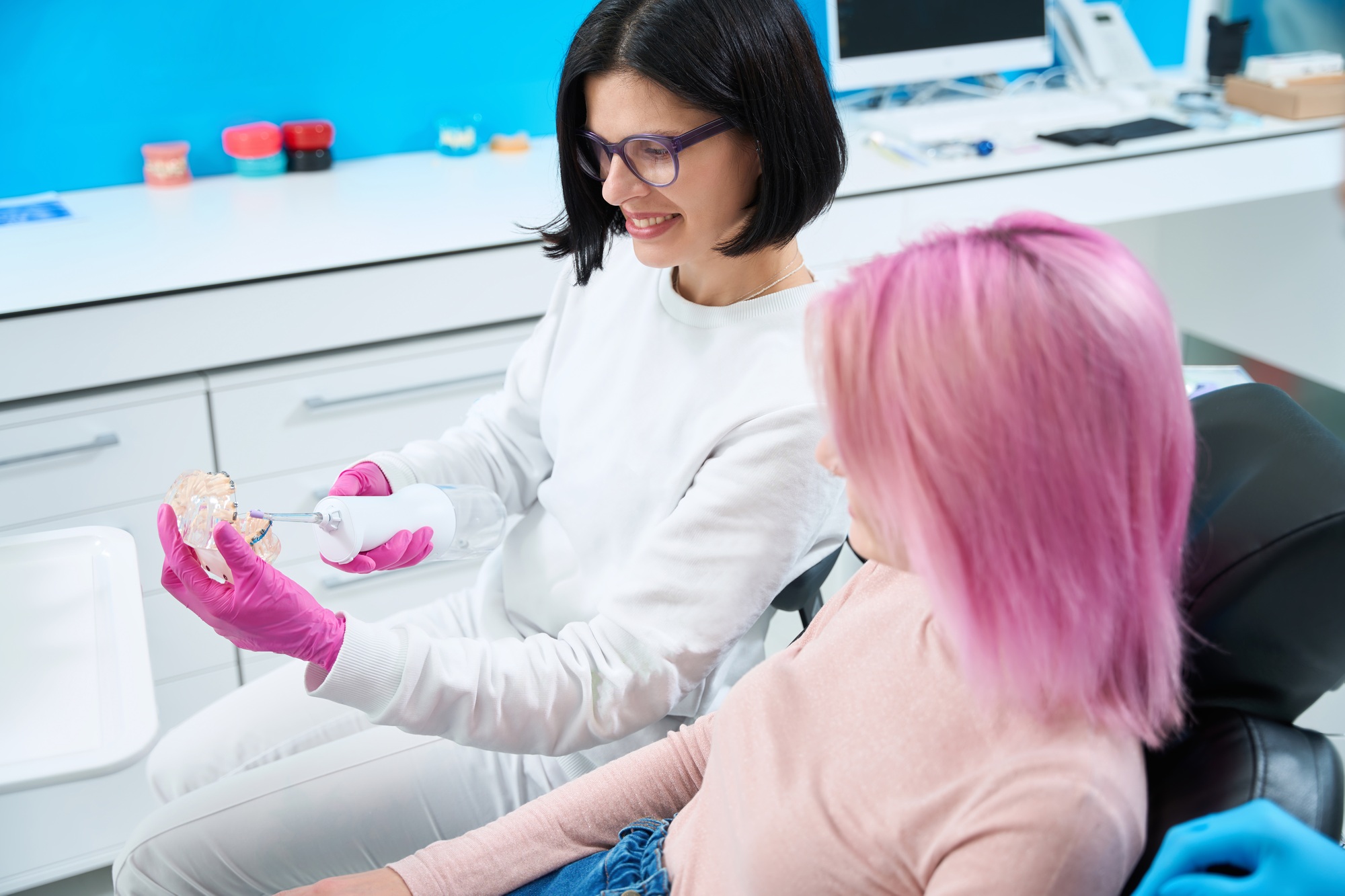Woman on a consultation with an orthodontist in dental clinic